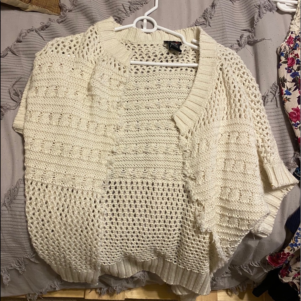 cream colored short sleeved cardigan